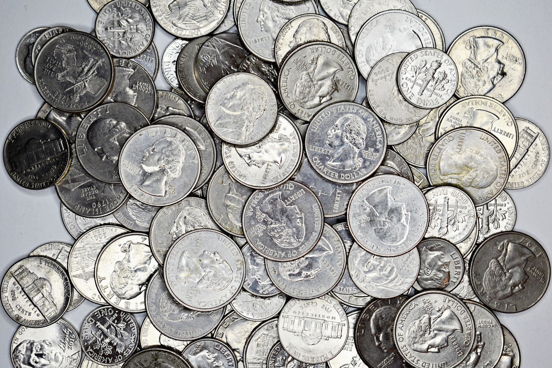 Close-up of US quarters, nickels and dimes